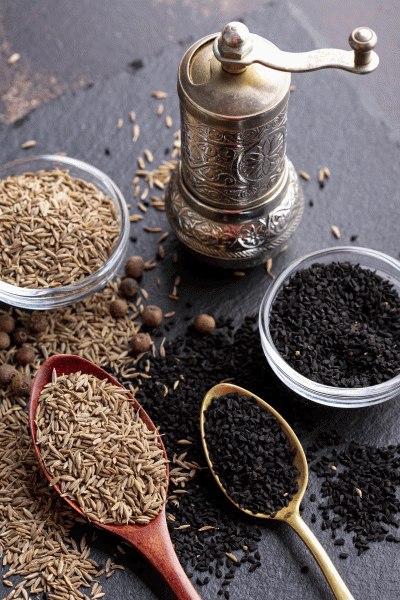 high-angle-variety-spices-with-grinder.jpg